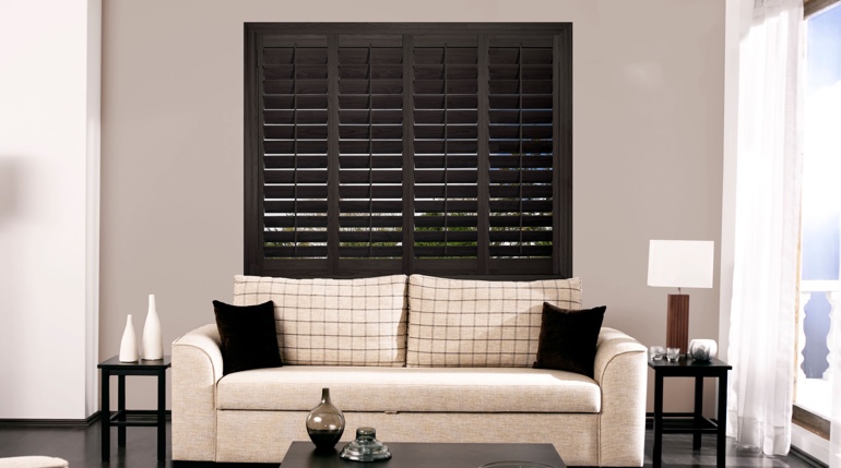 Bluff City living room with black shutters.